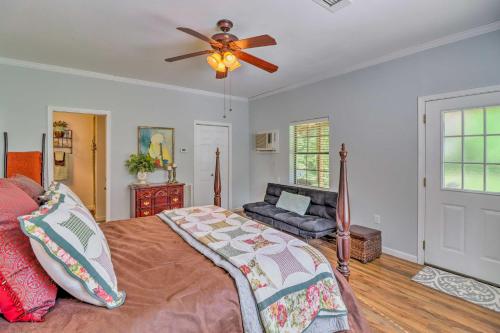 a bedroom with a bed and a ceiling fan at Heavenly Heber Springs Hideaway Fish and Hike! in Heber Springs