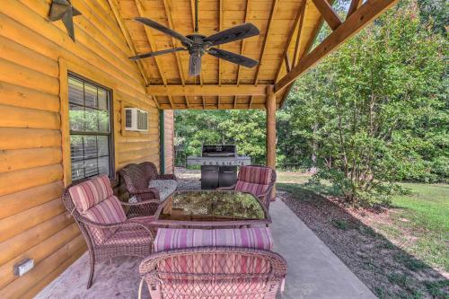 a patio with chairs and a table and a grill at Heavenly Heber Springs Hideaway Fish and Hike! in Heber Springs