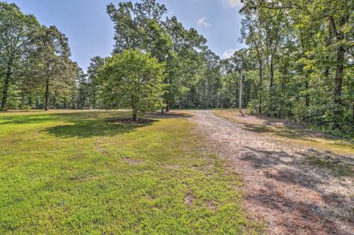 an open field with a tree in the middle at Heavenly Heber Springs Hideaway Fish and Hike! in Heber Springs