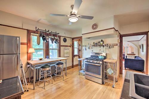 a kitchen with a stove and a refrigerator at Chic Milwaukee Apartment in Hip Neighborhood! in Milwaukee