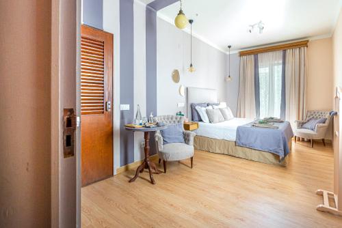 a bedroom with a bed with blue and white stripes at Casas da Formosa - Downtown Alegria in Tavira