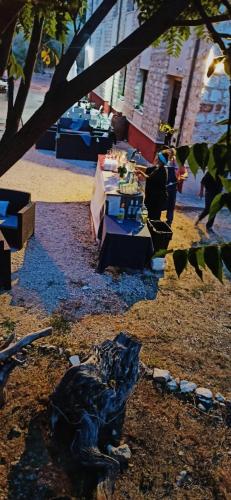 a table with a sculpture of a dog on the ground at La Sabina in Castillejo de Robledo