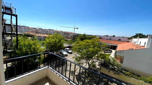 an apartment balcony with a view of a parking lot at Half Way Nazaré - Fátima - NSA-T2 in Marrazes