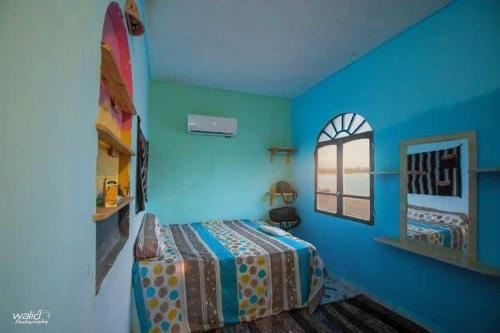 Postel nebo postele na pokoji v ubytování Rayan's Beach Camp