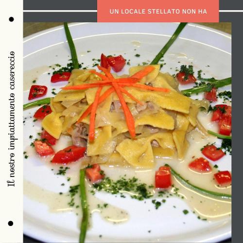 a plate of food with carrots and vegetables on it at Albergo Ristorante Monte Selva in Barisciano