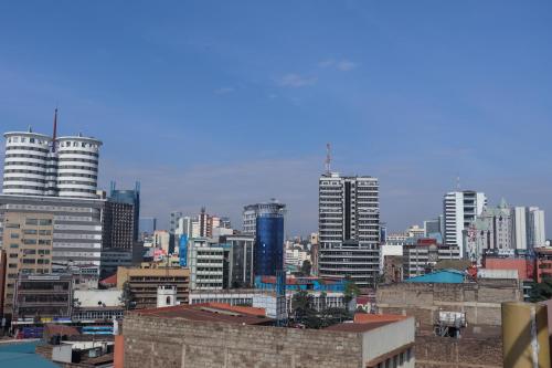 a view of a city with tall buildings at Hotel Sunrise in Nairobi