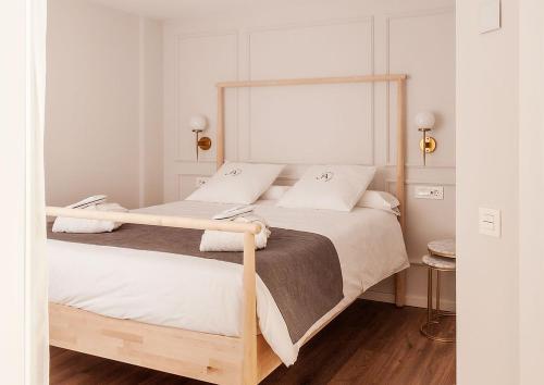 Postel nebo postele na pokoji v ubytování Aniana Alojamiento Boutique
