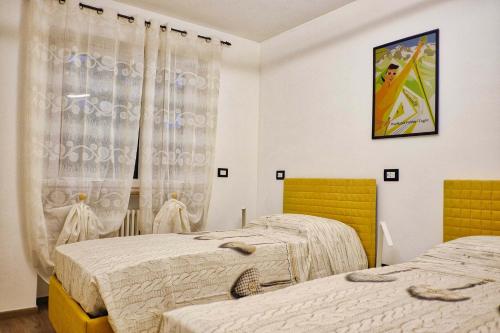 Una cama o camas en una habitación de Nuovo appartamento vacanze - CIR 0339