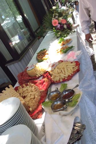 a table topped with lots of different types of food at Platani Hotel in Bolsena