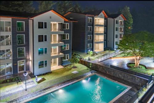 an image of an apartment complex with a swimming pool at Exceptional Deluxe Apartment Pucon near Lake and Volcano in Pucón
