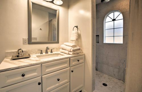 a bathroom with a sink and a shower at Oak Island Cottage Minutes to Long Beach! in Oak Island