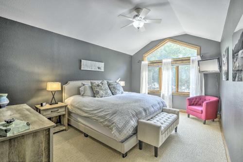 a bedroom with a bed and a pink chair at Rocky Mountain Retreat 2 Mi to Beaver Creek! in Avon