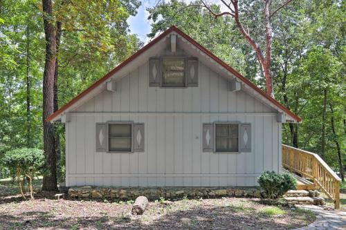 a white house in the middle of the woods at Beautiful Home with Mountain-View Deck and Smart TV in Warm Springs