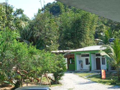 a small house in the middle of a forest at Suites Brejauva in Ubatuba