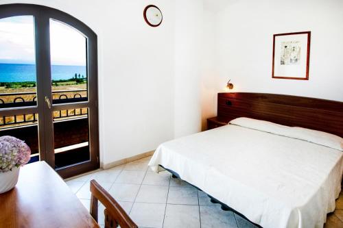 Postel nebo postele na pokoji v ubytování Hotel Gran Duca