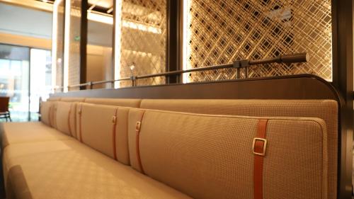 a row of beds in a waiting room at Hotel Indigo Jiuzhai by IHG in Jiuzhaigou