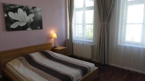 Кровать или кровати в номере Horvath Villa Apartman