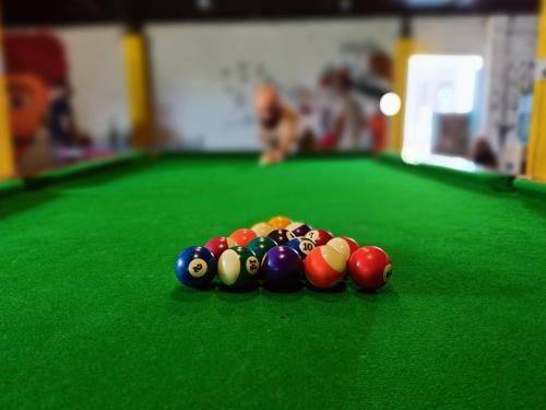 a group of billiard balls on a pool table at Elephant Pushkar in Pushkar
