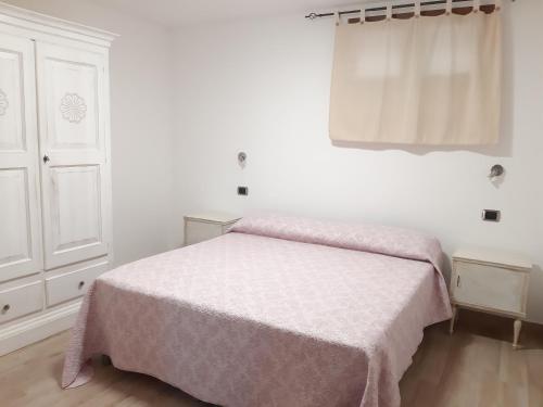Postel nebo postele na pokoji v ubytování Appartamento di Andrea