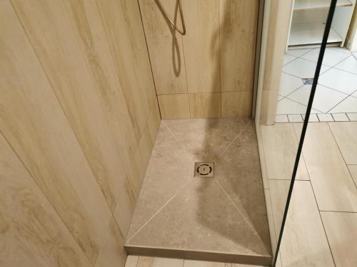 a shower with a no door sign in a bathroom at Casa Vacanze Monachy in Merano