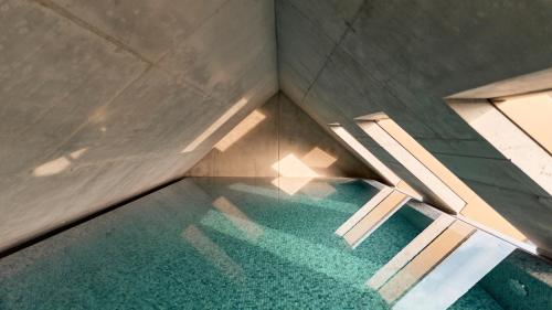 an overhead view of a swimming pool with a glass floor at Karl August - a Neighborhood Hotel in Nürnberg