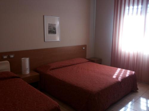 Posteľ alebo postele v izbe v ubytovaní Al Flor