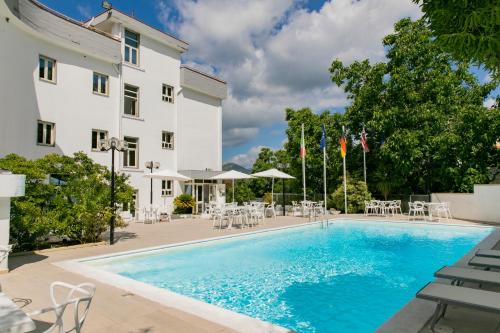 a swimming pool in front of a building at Hotel Sica in Montecorvino Rovella