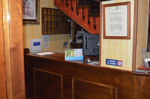 a cash counter with a computer on top of it at Hotel Don Javier in Ronda