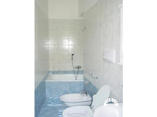 a bathroom with a toilet and a bath tub at Al Poggio Antico in Amalfi