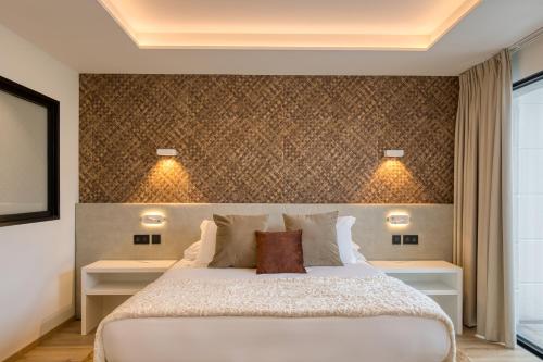 a bedroom with a large bed with two night stands at Best Western Plus Le Fairway Hotel & Spa Golf d'Arras in Anzin-Saint-Aubin