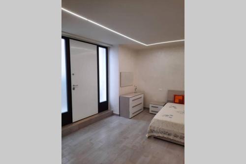 A bed or beds in a room at Chez Lulù
