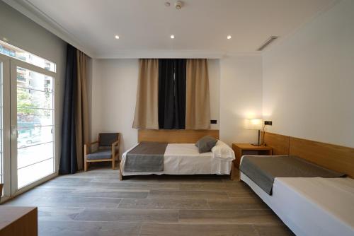Postel nebo postele na pokoji v ubytování Hotel Artmadams