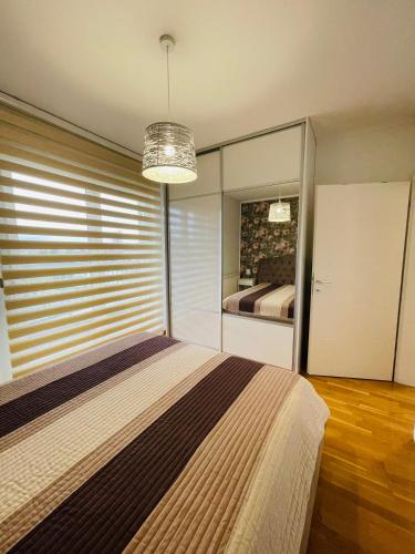 Postel nebo postele na pokoji v ubytování Apartman M&M