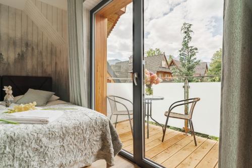 Posteľ alebo postele v izbe v ubytovaní Apartamenty Jedlina