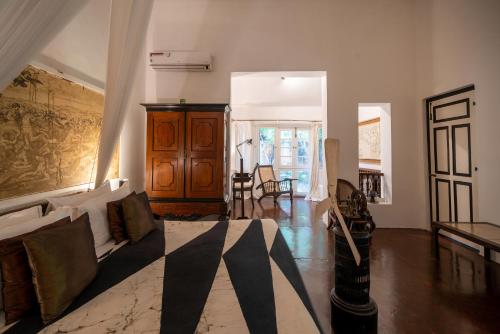 a living room with a couch and a table at Lunuganga Estate in Bentota