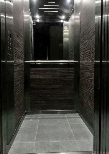 a hallway with a walk in shower in a building at F11 Room 1, Private double room with private bathroom in shared Flat in Msida