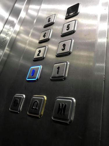 a close up of the buttons of an elevator at F11 Room 1, Private double room with private bathroom in shared Flat in Msida