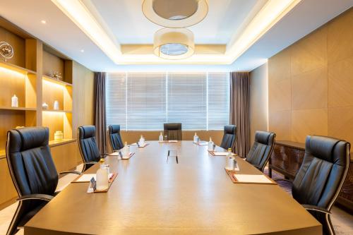 a conference room with a long table and chairs at Crowne Plaza Vientiane by IHG in Vientiane