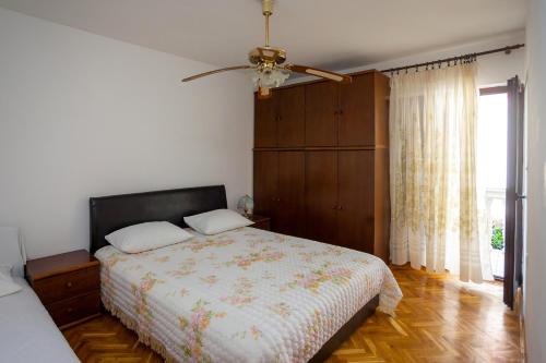 Cama o camas de una habitación en Apartments Ratković