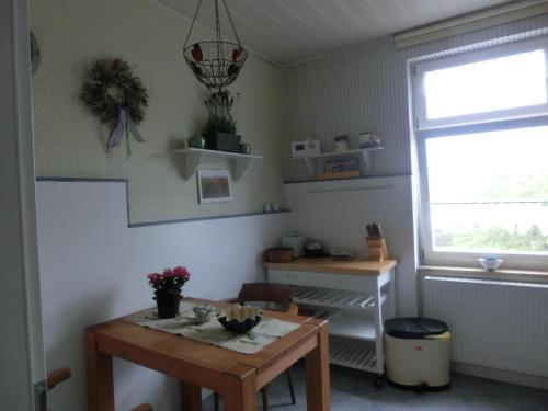 a dining room with a table and a window at Villa Harmonie in Lohme