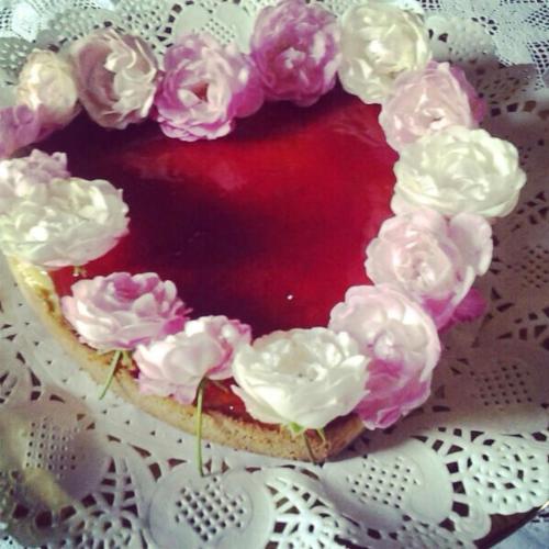 a cake with pink and white flowers on it at Antica Dimora Conti Custoza in Roverbella