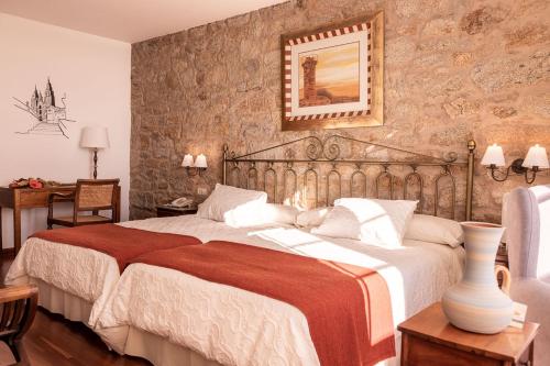 Postel nebo postele na pokoji v ubytování Hotel Rústico Finisterrae