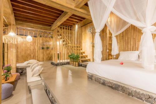 A bed or beds in a room at ✰ Camaya Bali Suboya - Magical Bamboo House ✰