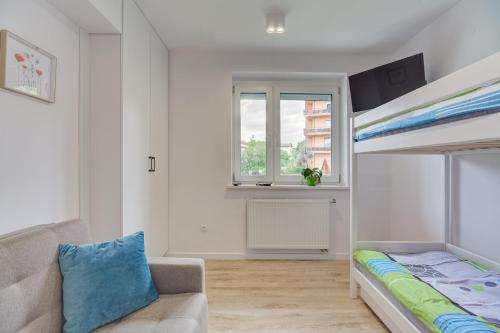 Posteľ alebo postele v izbe v ubytovaní Apartament Ola