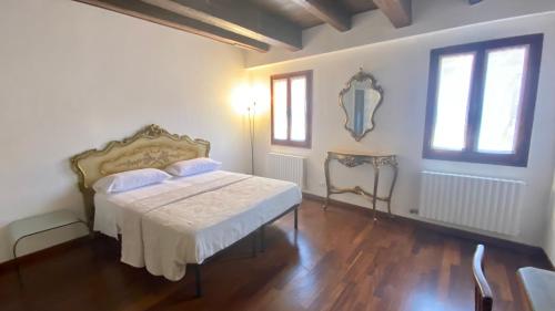 Postel nebo postele na pokoji v ubytování Sogno Veneziano