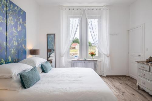 Postel nebo postele na pokoji v ubytování Manoir des Bertinières