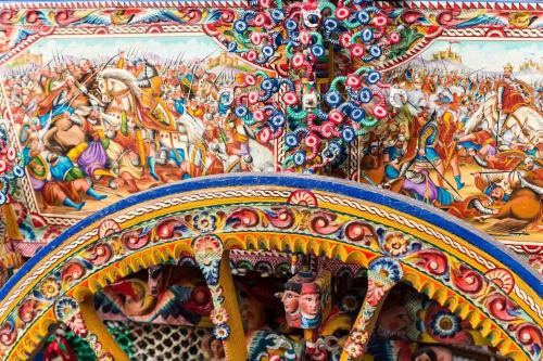 a close up of a carousel with a painting on it at B&B ComeinSicily CortedeiLimoni Charming & Relax in Acireale