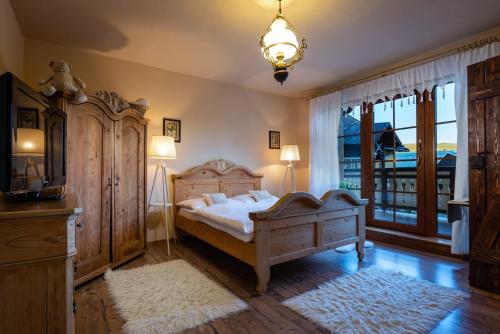 Una cama o camas en una habitación de Penzion Enrico