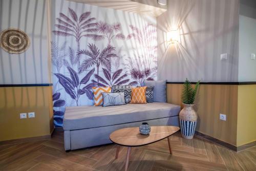 a living room with a couch and a table at KRISSAIA SEASIDE SUITES in Galaxidhion