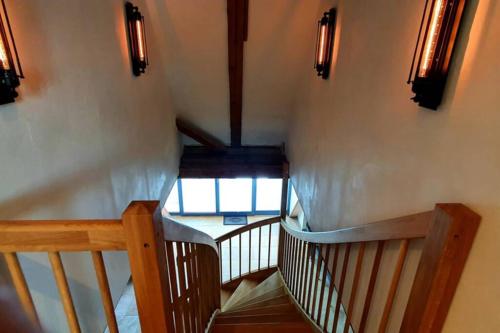 a wooden staircase with a view of a window at Apartment Vertex in Creglingen